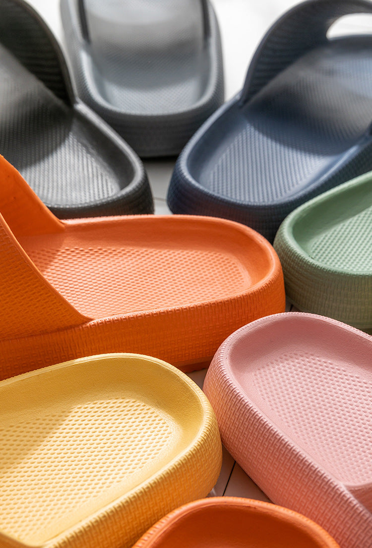 Various pairs of CloudSlides in different colors arranged in a circle, highlighting the stylish and versatile design of these comfortable sandals