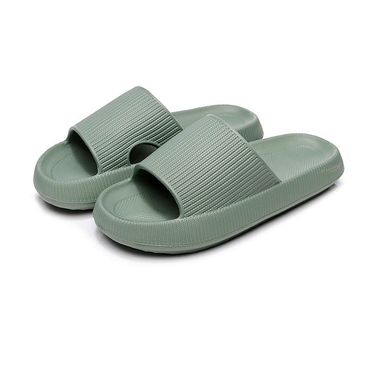 Green CloudSlides™ with soft, contoured footbed and calming hue, combining comfort with a nature-inspired look
