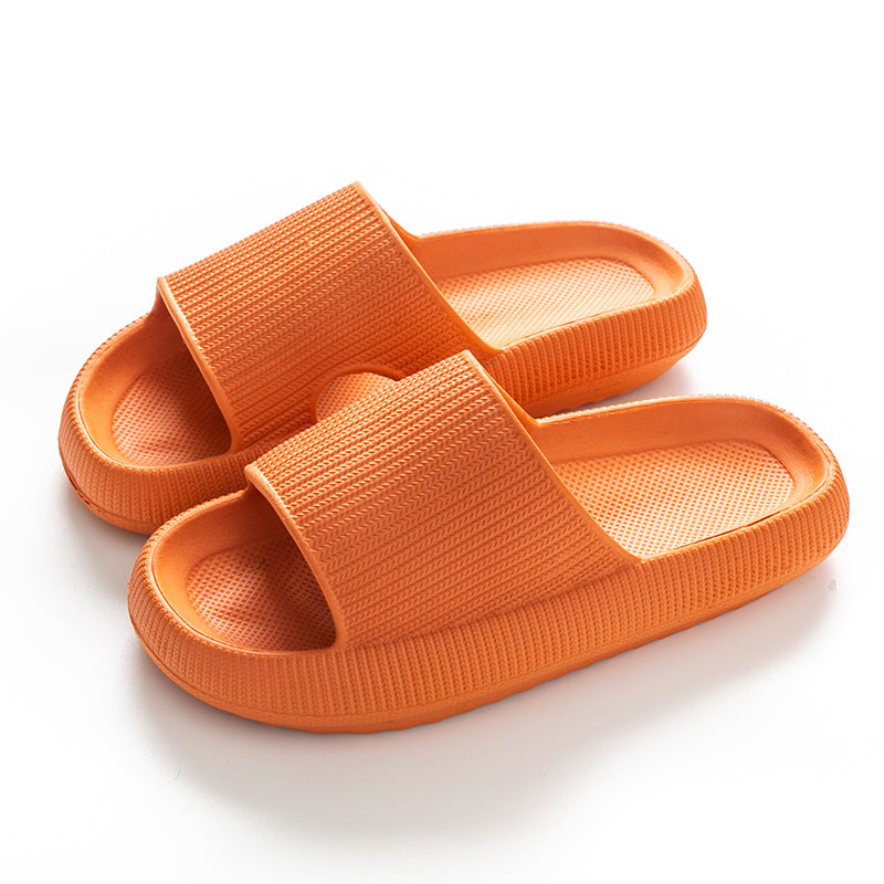 Orange CloudSlides™ with thick cushioned sole and wide strap, designed for everyday comfort and vibrant summer style